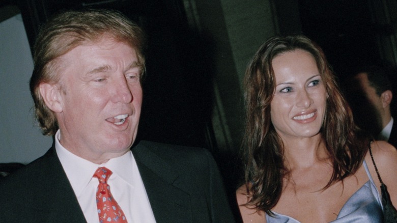 Donald Trump walking with Melania Trump in 1998