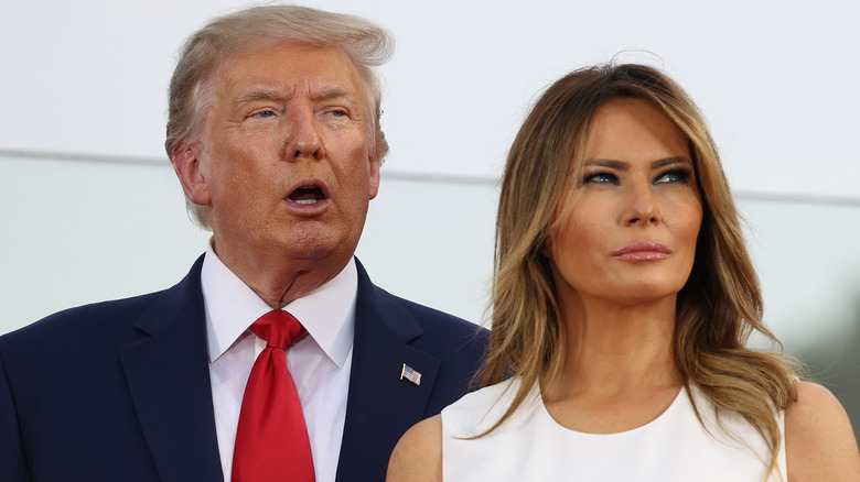 Donald Trump speaking and Melania Trump looking annoyed