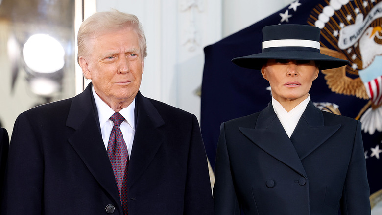 Donald and Melania Trump staring ahead