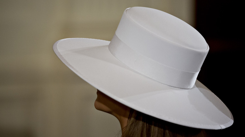 Melania Trump wearing the hat she is auctioning off