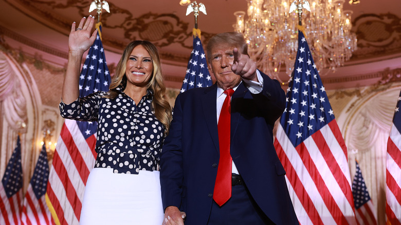 Melania and Donald Trump waving and pointing