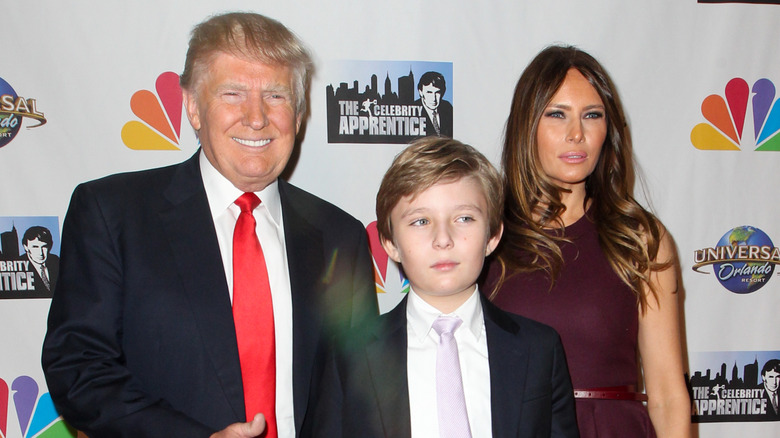 Donald Trump, Barron Trump, and Melania Trump at a red carpet event for The Apprentice