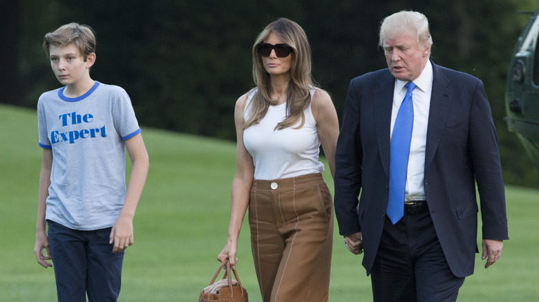 Melania Trump walking with Donald and Barron