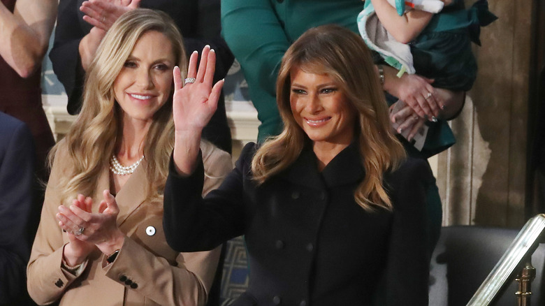 Lara Trump applauding, Melania Trump waving