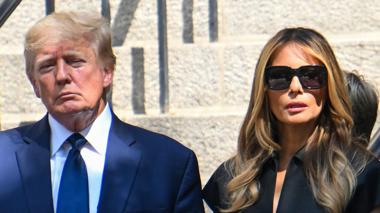 Donald Trump and Melania Trump frowning