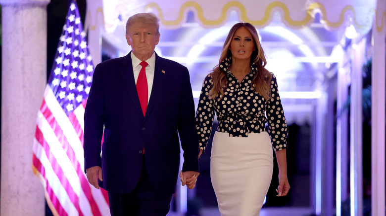 Donald and Melania Trump holding hands