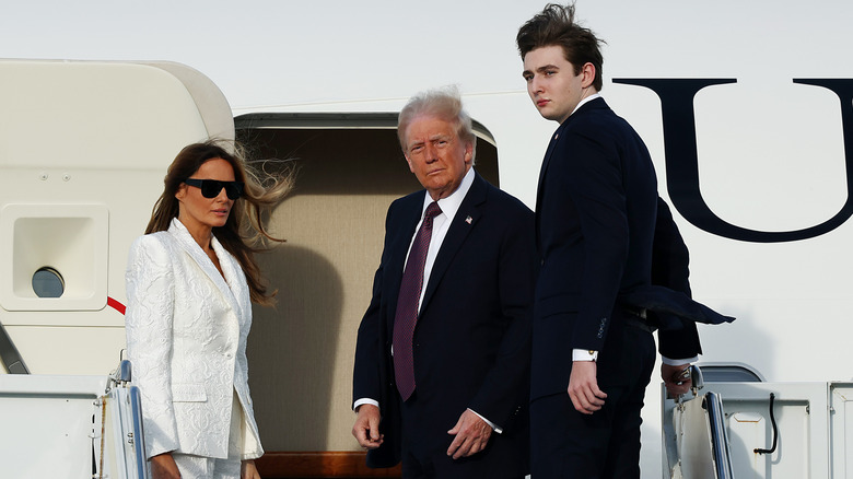 Melania Trump, Donald Trump, and Barron Trump getting on plane