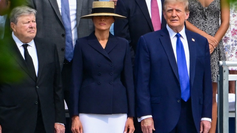 Melania and Donald Trump at Barron graduation big hat