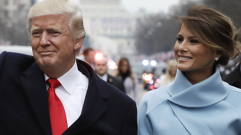 Donald Trump and Melania Trump standing side by side, smiling