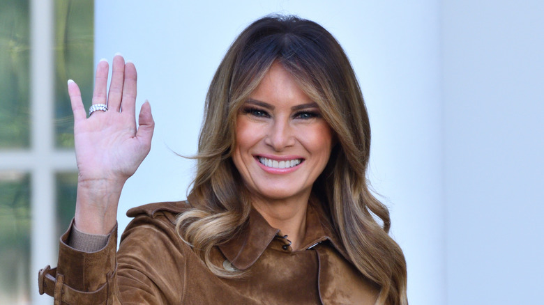 Melania Trump smiling and waving