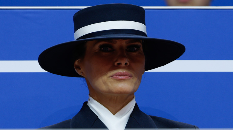 Melania Trump staring blankly in a hat