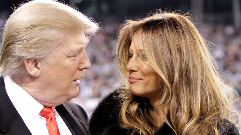 Melania Trump smiling at Donald Trump