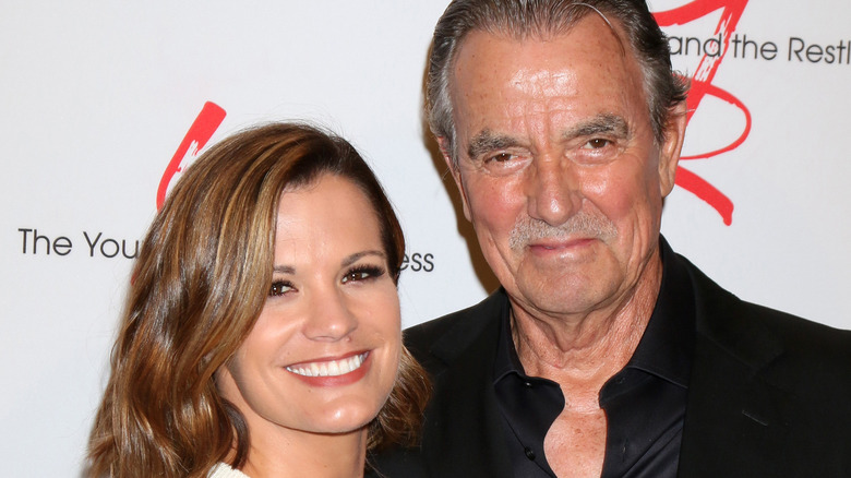 Melissa Claire Egan and Eric Braeden posing together at event