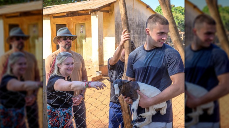 Mason Wilkerson holding a baby goat