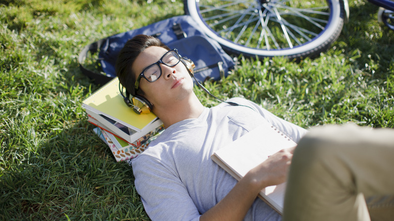 Man listening to music on grass