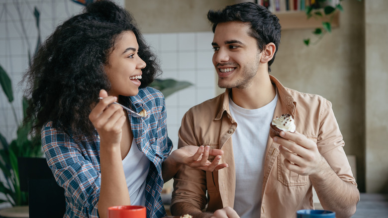 couple sharing dessert on a date