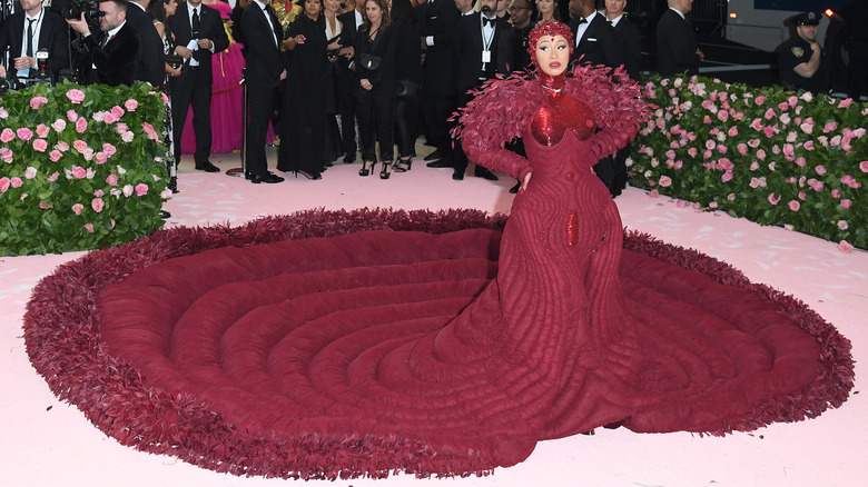 Cardi B in a red over the top gown