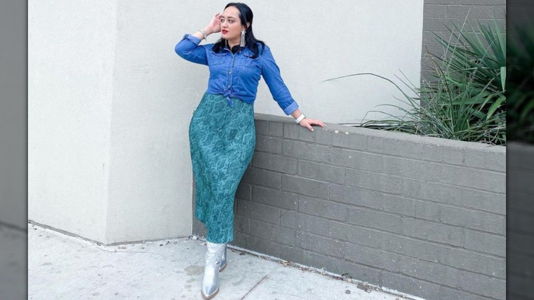 woman posing in green skirt