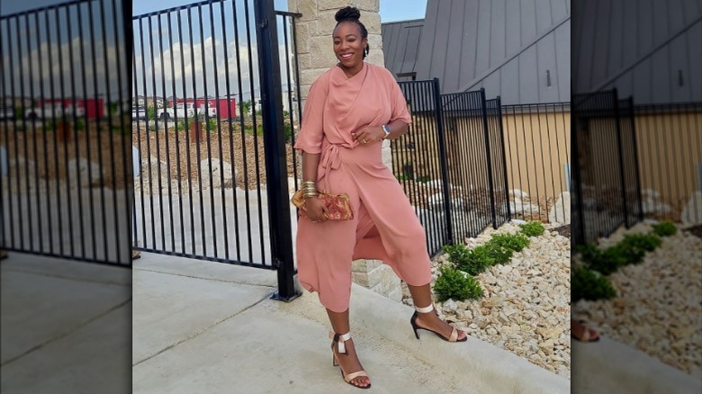 woman in pink outfit posing