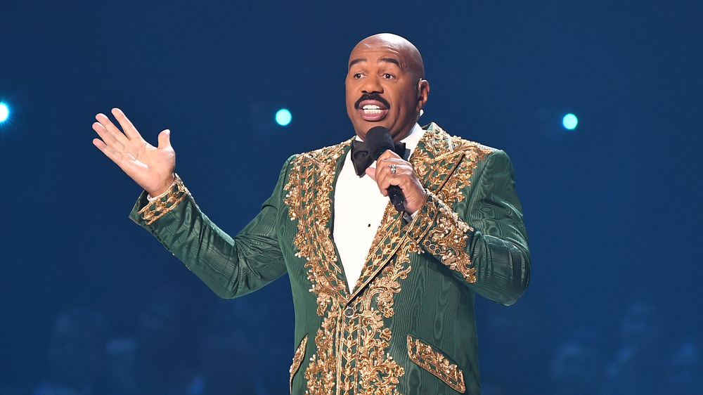 Steve Harvey speaking on stage