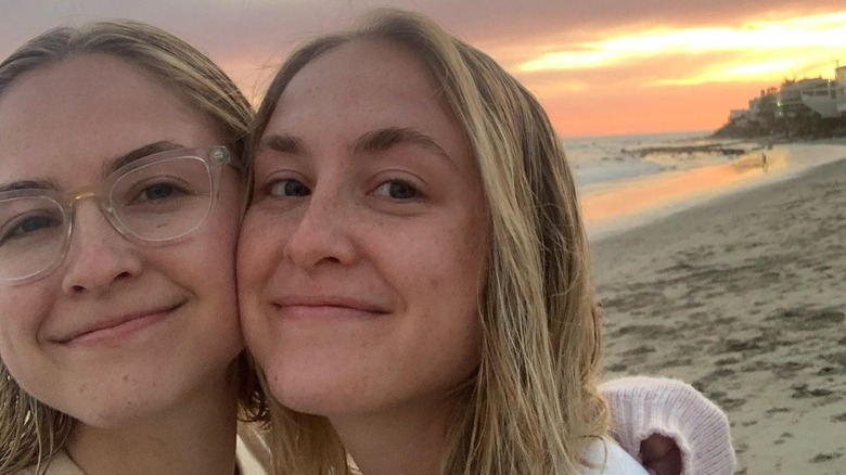 Aquinnah and Schuyler Fox smiling in a selfie on the beach