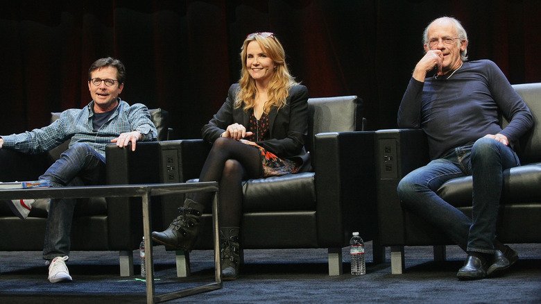 Michael J. Fox sits at Comic Con next to Back to the Future co-stars