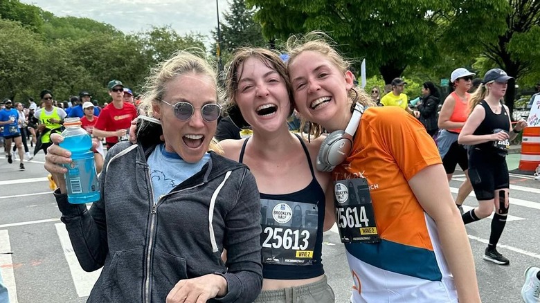 Esme, Schuyler, and their mom smiling at the Brooklyn half marathon