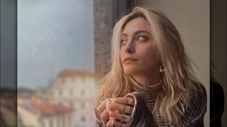 Paris Jackson looking out window