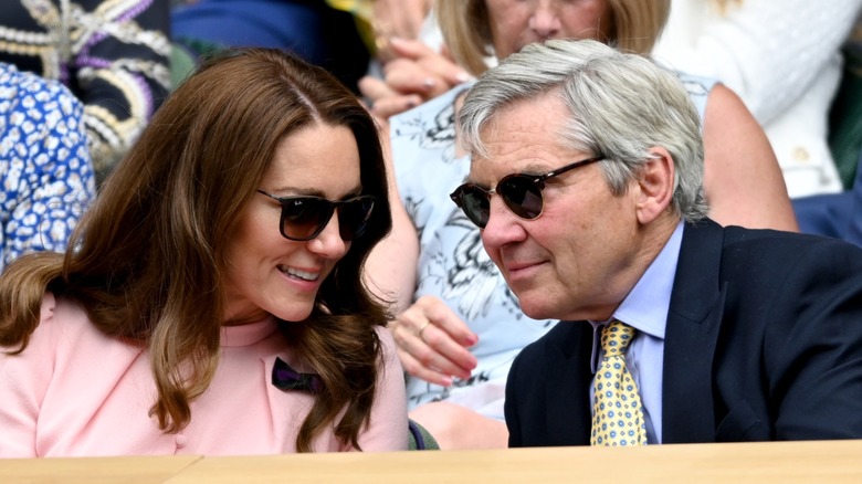 Kate Middleton and Michael Middleton talking