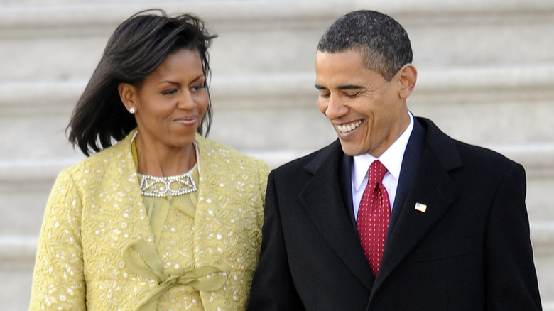 Barack and Michelle Obama walking side by side