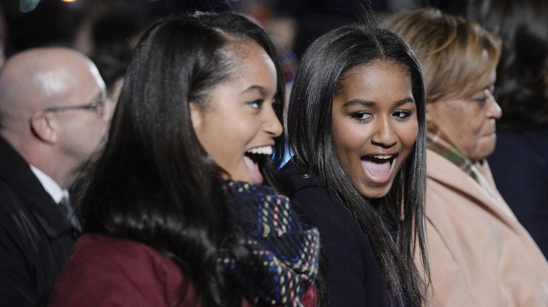 Malia and Sasha Obama laughing