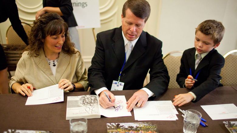 Michelle and Jim Bob Duggar signing books