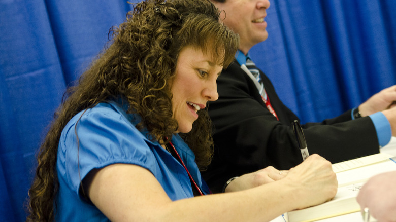 Michelle Duggar signing autographs