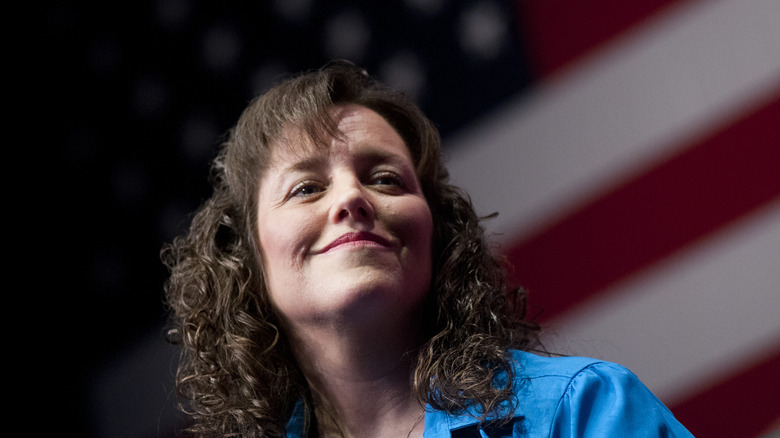 Michelle Duggar in front of American flag