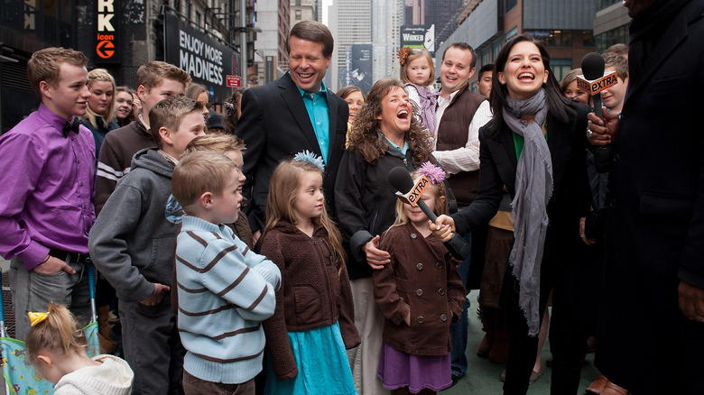 Michelle and Jim Bob Duggar with children in New York