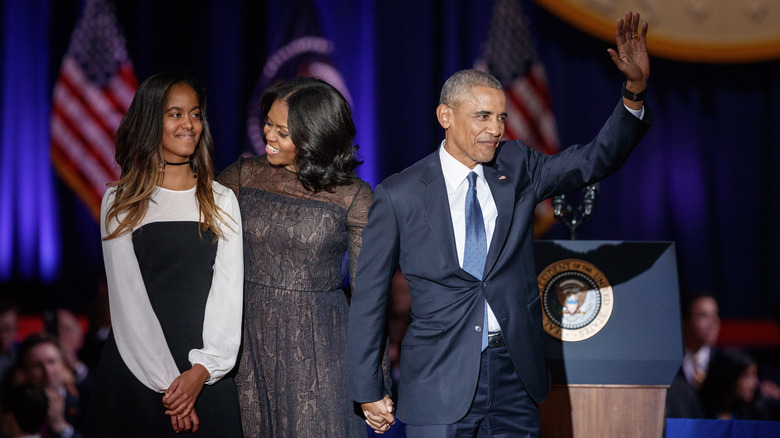 Barack and Michelle Obama with their daughter