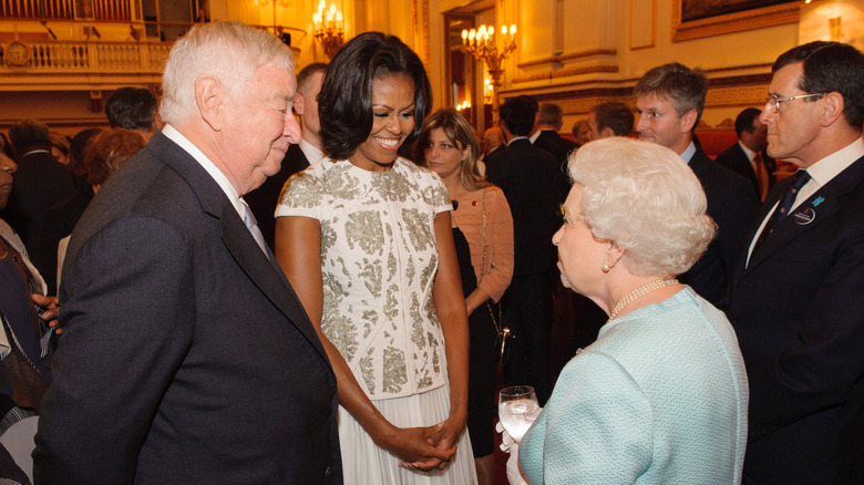 Michelle Obama speaking to Queen Elizabeth