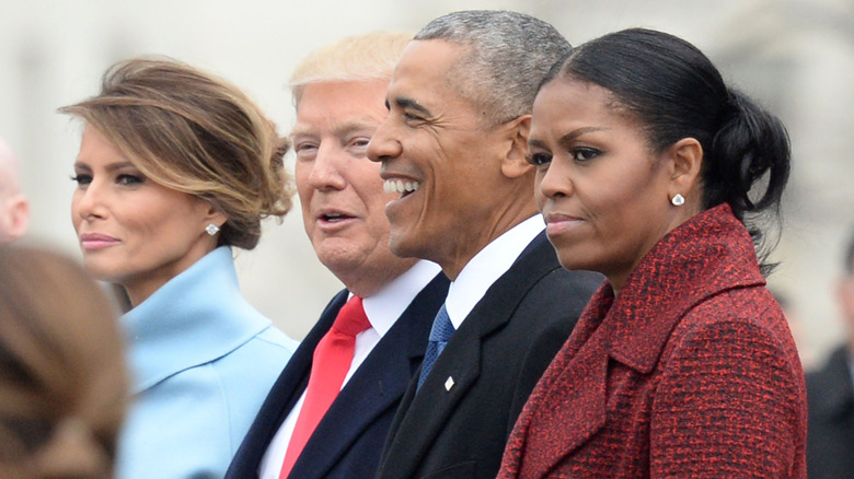 Michelle Obama and Barack Obama stand with Donald Trump and Melania Trump at the 2017 inauguration