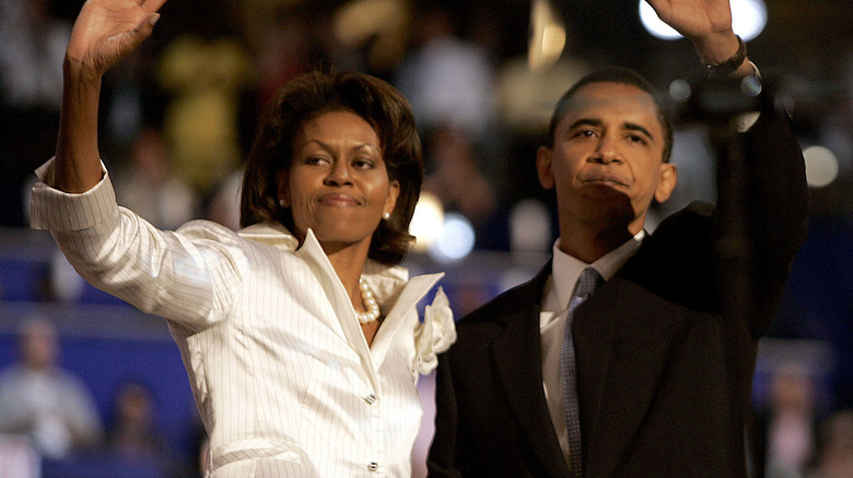 Michelle and Barak Obama waving 