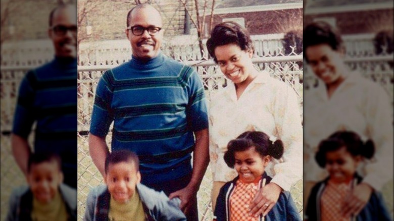 Fraser and Marian Robinson smiling with young Craig and Michelle