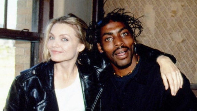 Michelle Pfeiffer with an arm around Coolio