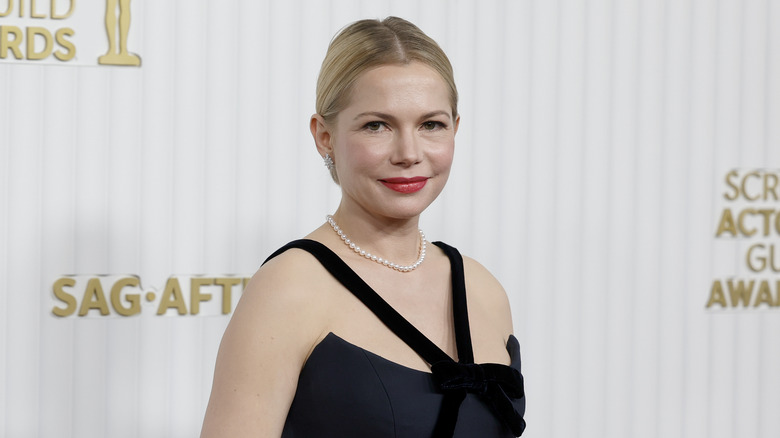 Michelle Williams smiles on red carpet