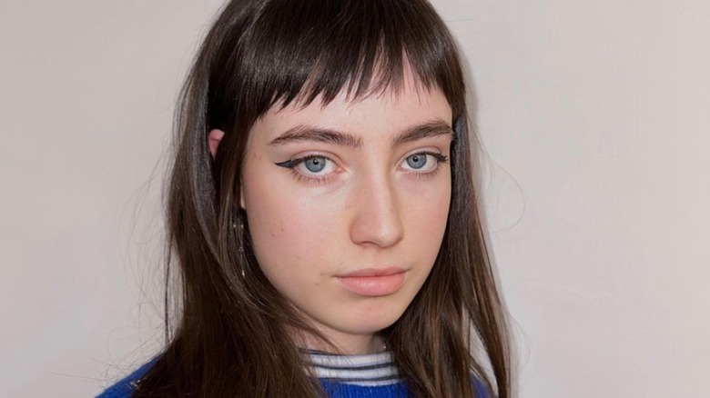 A girl with micro bangs