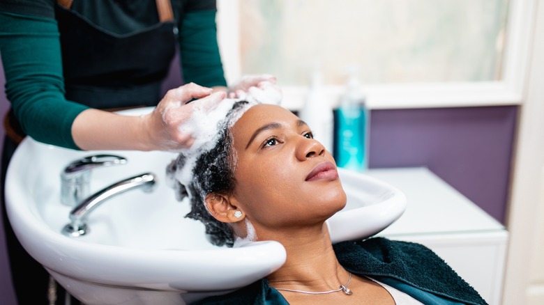 woman getting her hair washed