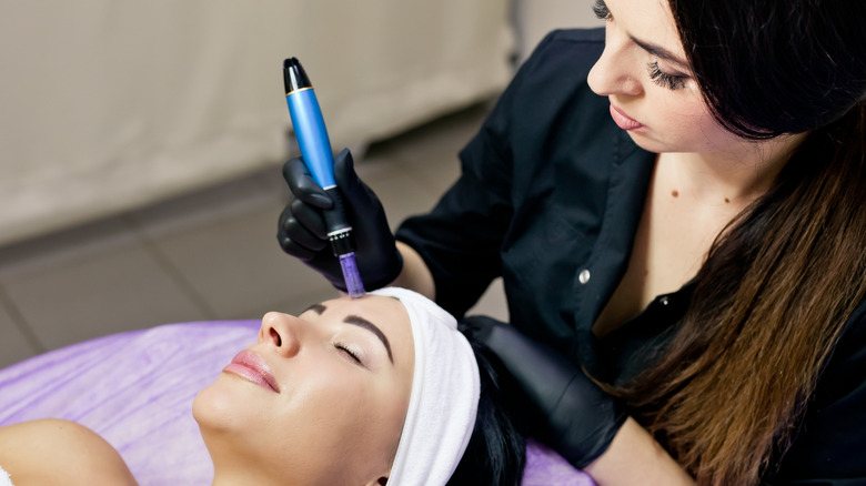 doctor administering microneedling treatment