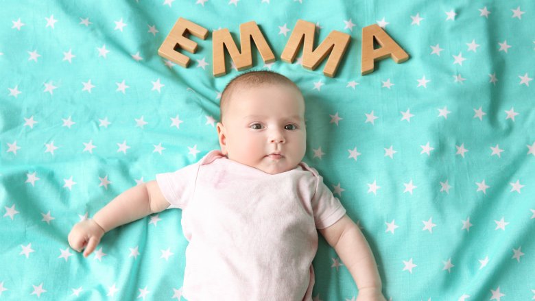 baby with letters Emma above head