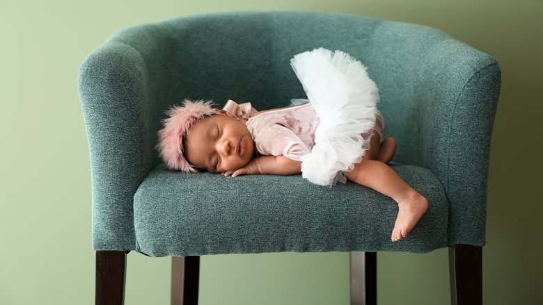 baby sleeping on armchair