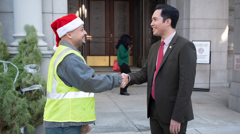 Mike Cabellon shaking hands on set