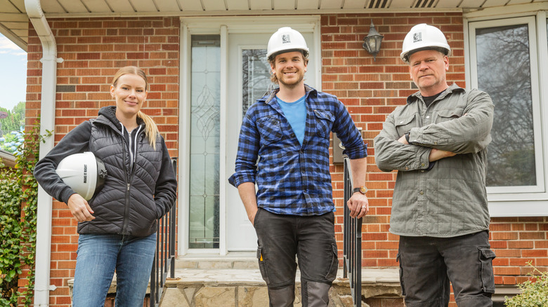 Holmes family in front of house