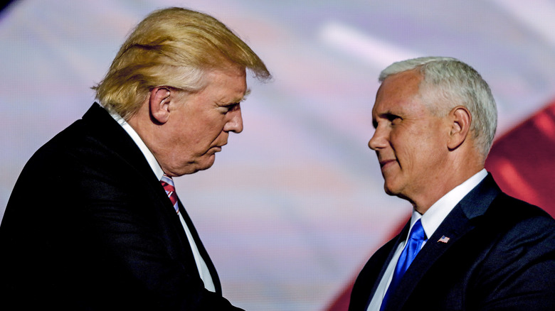 Donald Trump and Mike Pence facing each other